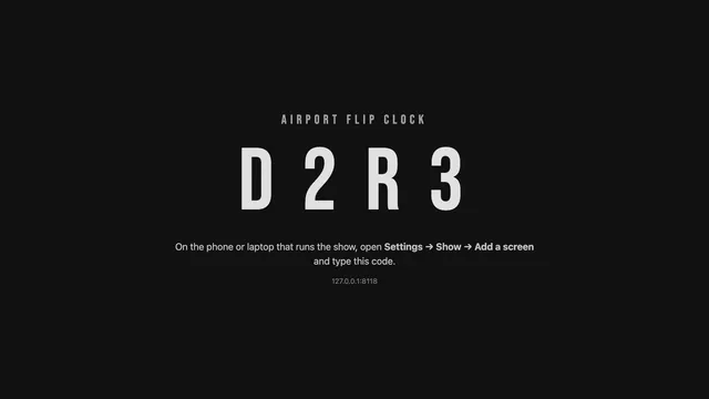 A bare screen showing Airport Flip Clock’s 4-letter pairing code in large letters