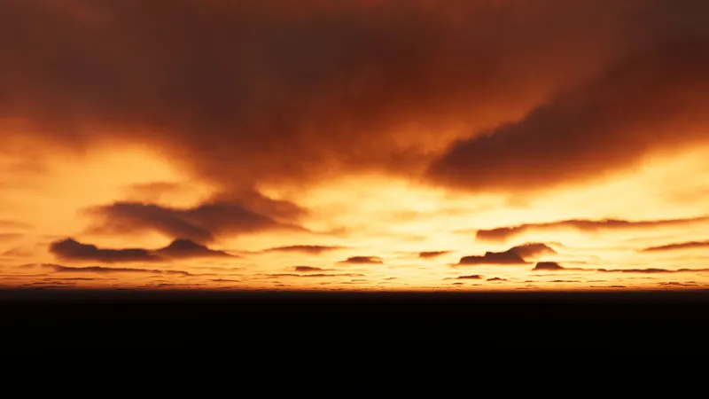 A fiery orange sunset sky with dark storm clouds